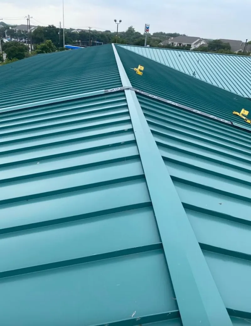 Green commercial metal roof ridge and valley for Metal Roof Repair in Cuero
